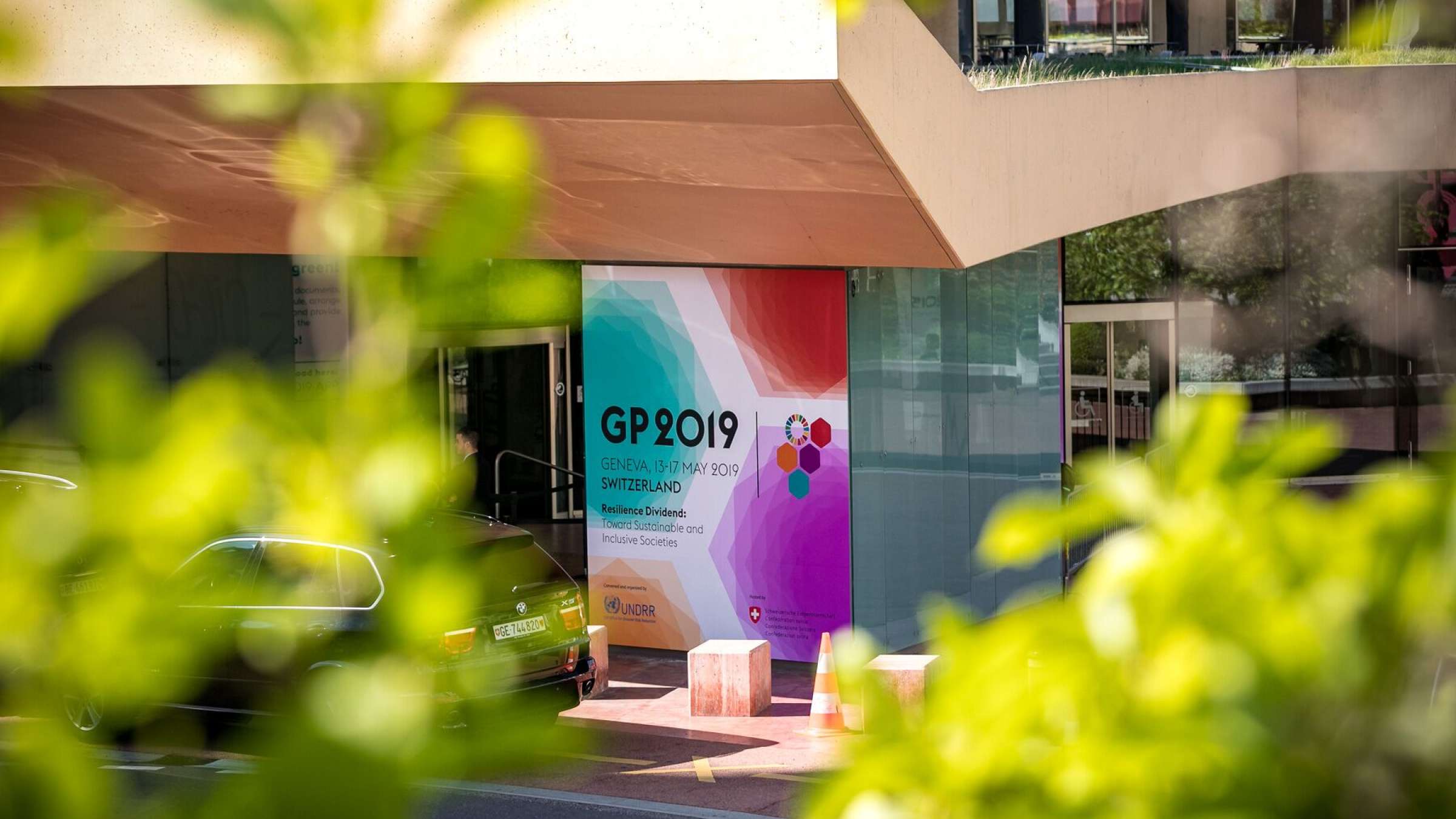  Colorful banner with GP2019 dates and logos placed outside the conference venue